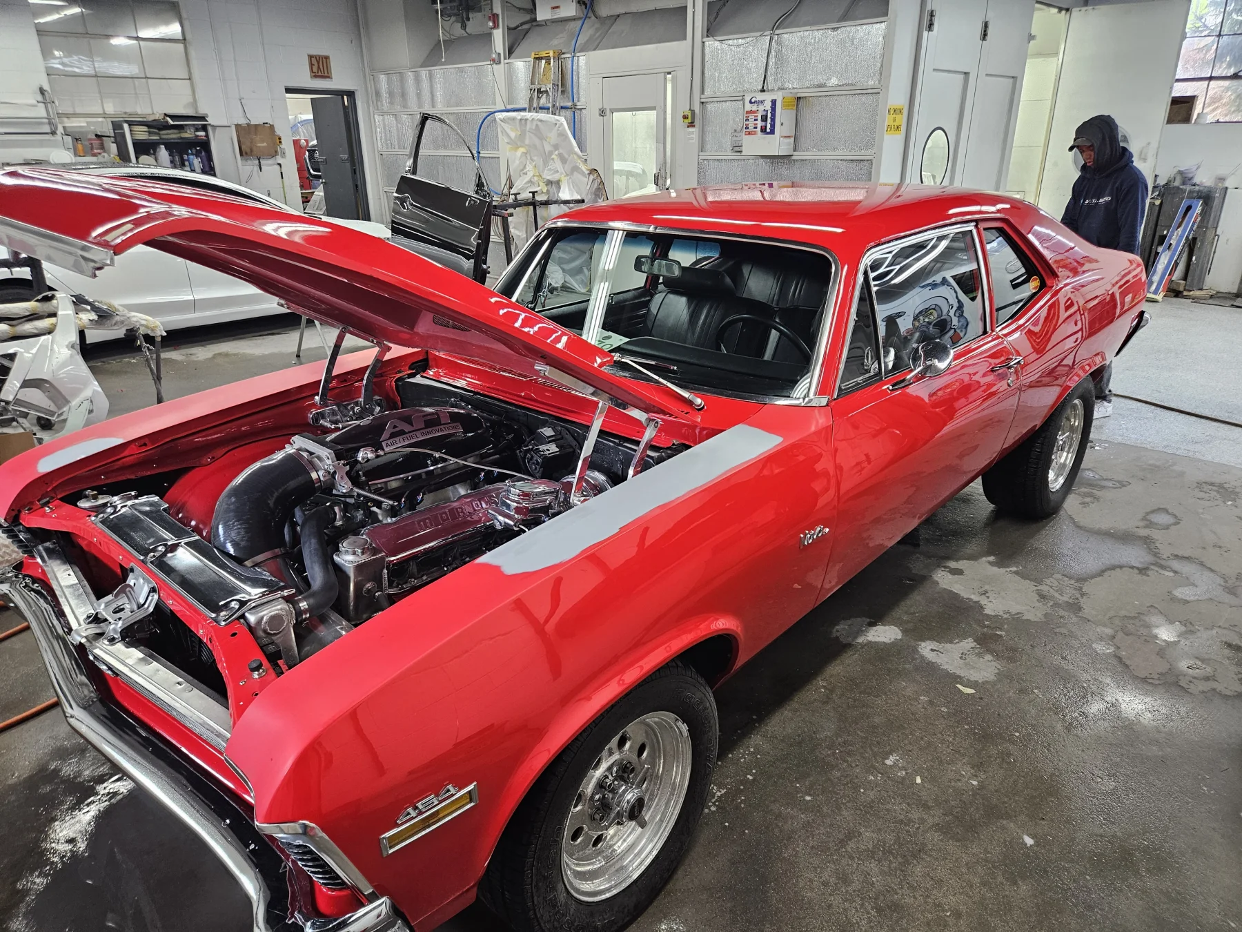 Red classic Chevrolet undergoing body work at Delta Auto